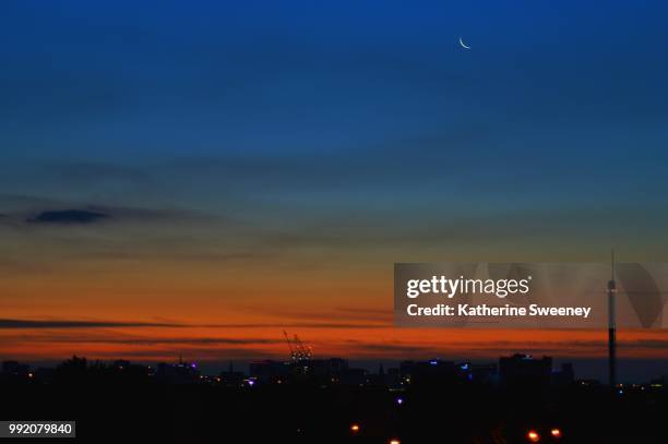 sunset & the moon over glasgow skyline - glasgow sunrise stock pictures, royalty-free photos & images