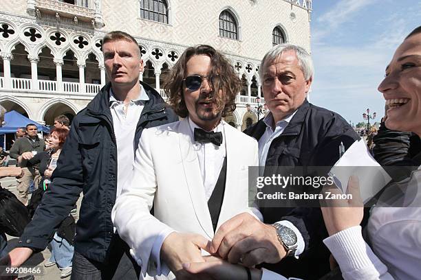 Actor Johnny Depp meets fans on location for "The Tourist" at Piazza San Marco on May 13, 2010 in Venice, Italy.