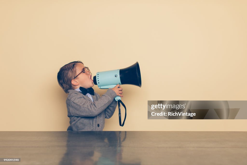 Young Nerd Boy Yells into Megaphone