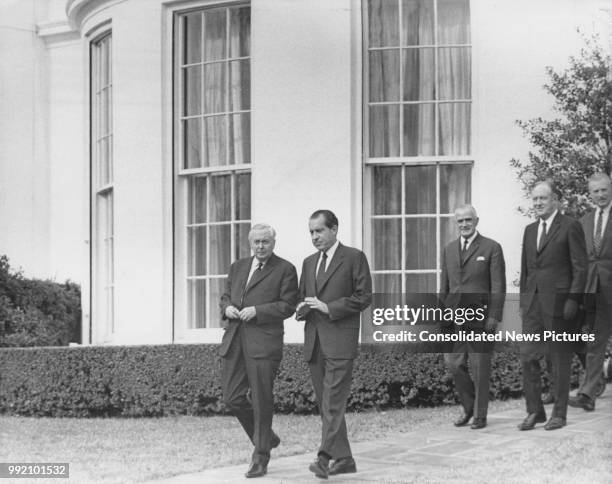 President Richard Nixon walking in the grounds of the White House, Washington, DC, with British Prime Minister Harold Wilson , after their talks in...