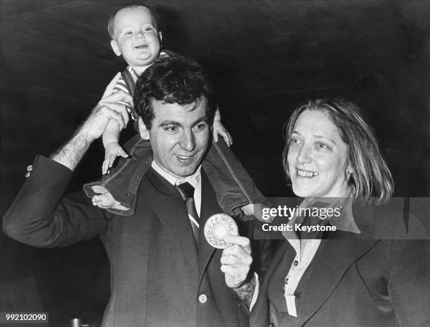 American squash champion Victor Niederhoffer with his wife Gail and daughter Galt after receiving a Pierre de Coubertin trophy for fair play at the...