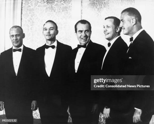 President Richard Nixon poses with the Apollo 11 astronauts before a state dinner in their honour at the Century Plaza Hotel in Los Angeles, 18th...