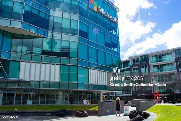 People walk through the corporate campus at the regional headquarters of Microsoft in Auckland, New Zealand, February 26, 2018.