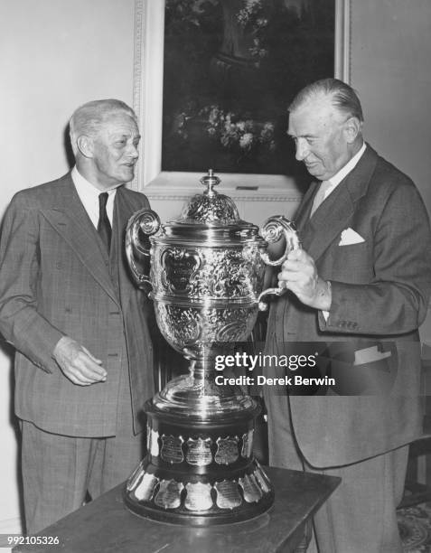 English motor manufacturer William Morris, 1st Viscount Nuffield receives the Dewar Trophy for 1959 from Wilfred Andrews , Chairman of the Royal...