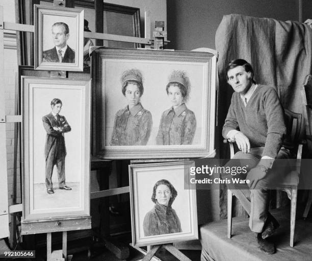 English artist Michael Noakes at his studio in Reigate, Surrey, with his portraits of Princess Anne, Princess Margaret, Prince Philip and Prince...