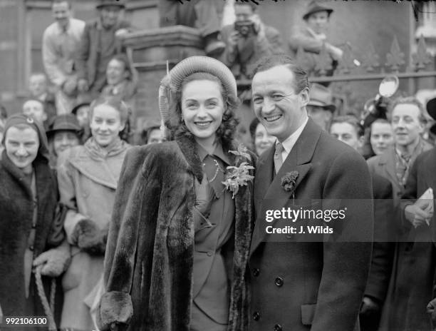 English actor David Niven and his second wife Hjördis Tersmeden at the South Kensington Register Office in London after their wedding, 14th January...