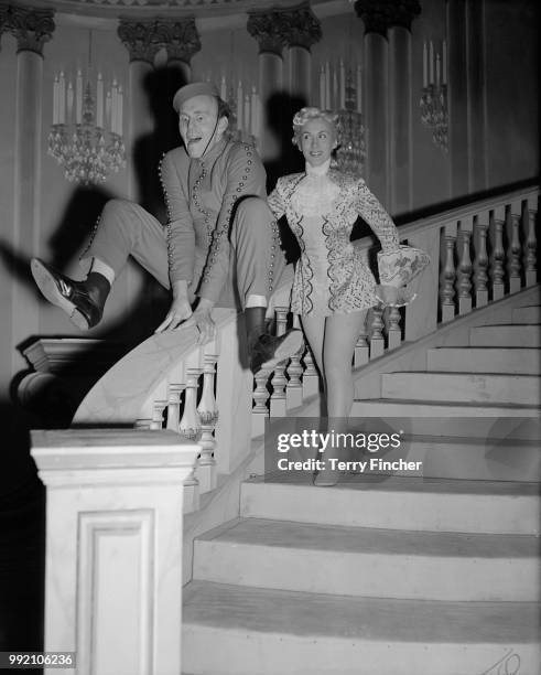 English magician and television personality David Nixon as Buttons, and his wife Paula Marshall as Dandini during rehearsals for the pantomime...