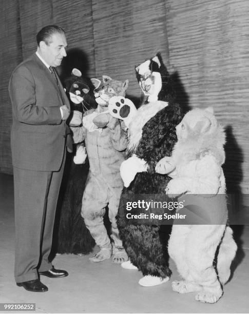 British theatre director Robert Nesbitt auditions four actresses at the London Palladium, for the role of Dick Whittington's cat in the pantomime...