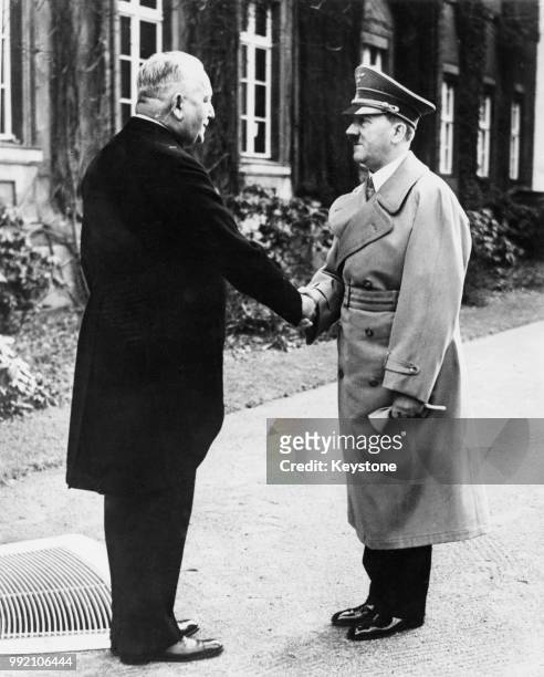 German diplomat Konstantin von Neurath , the Reich Minister of Foreign Affairs, receives congratulations from German leader Adolf Hitler in Berlin,...