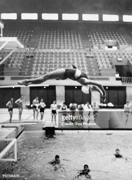 Year-old British diver Denise Newman trains at Wembley for the Women's Diving Championships at the Empire Pool in London, 23rd June 1938. Newman has...