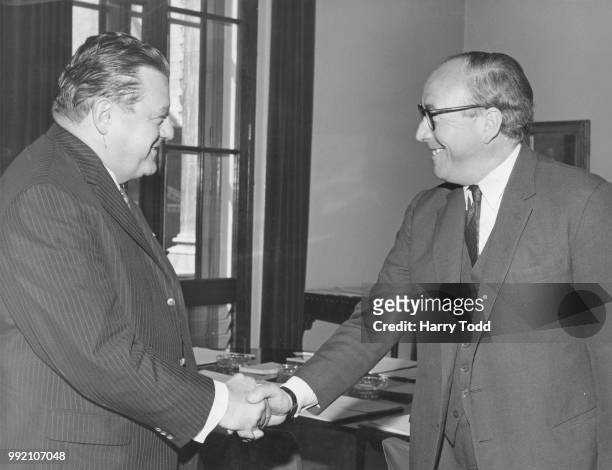 Franz Josef Strauss , the German Federal Minister of Finance, is greeted by British Chancellor of the Exchequer Roy Jenkins at the Treasury in...