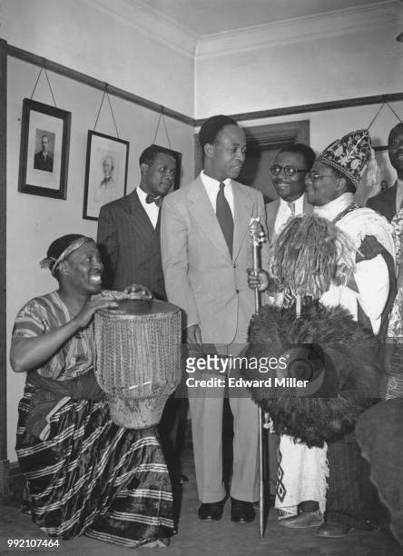 Ghanaian politician Kwame Nkrumah , leader of the United Gold Coast Convention, is greeted at Conway Hall in London by drummer Alf Payne and Chief...
