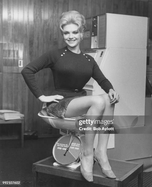 Australian singer and actress Patsy Ann Noble, who later performed as Trisha Noble, attends the opening celebrations of Anglowest Laundry's 100th...