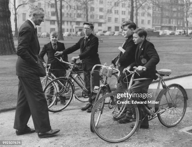 British Conservative politician Richard Nugent , Parliamentary Secretary to the Ministry of Transport, talks to a group of boys at the inauguration...