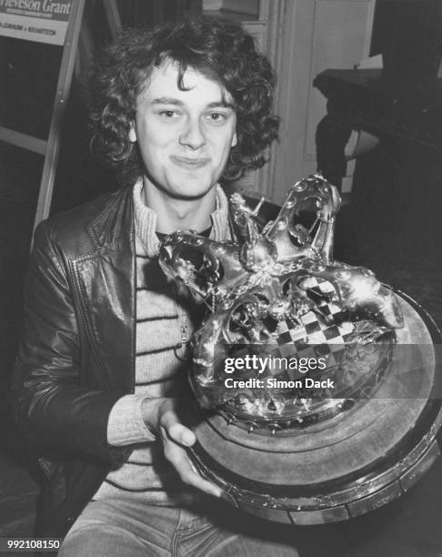 New British chess champion John Nunn receives his trophy at the RAC Club in Pall Mall, London, 20th February 1981. Nunn was awarded the trophy by...