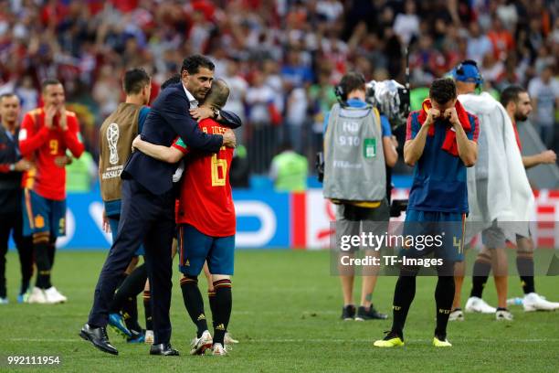 Andres Iniesta of Spain and Head coach Fernando Hierro of Spain look dejected after the 2018 FIFA World Cup Russia match between Spain and Russia at...