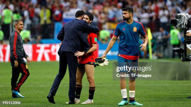 Isco Alarcon of Spain and Head coach Fernando Hierro of Spain look dejected after the 2018 FIFA World Cup Russia match between Spain and Russia at...