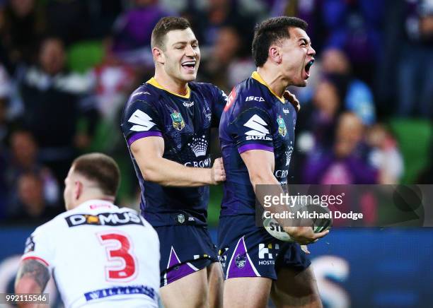 Jahrome Hughes of the Storm celebrates a try during the round 17 NRL match between the Melbourne Storm and the St George Illawarra Dragons at AAMI...