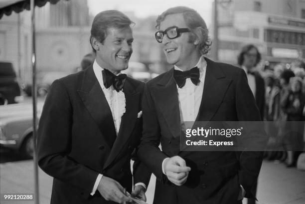 English actors Roger Moore and Michael Caine attend the premiere of mystery thriller film Sleuth at the Odeon cinema near Marble Arch, London, UK,...