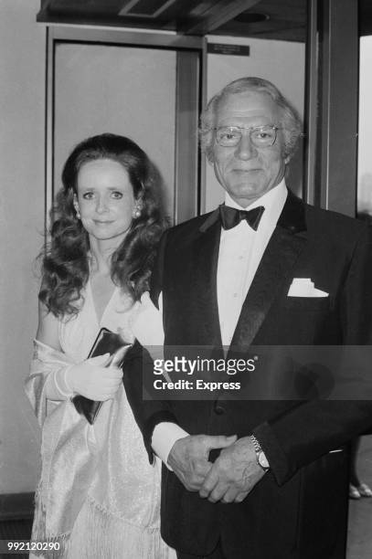 English actor and director Laurence Olivier and guest attend the premiere of mystery thriller film Sleuth at the Odeon cinema near Marble Arch,...