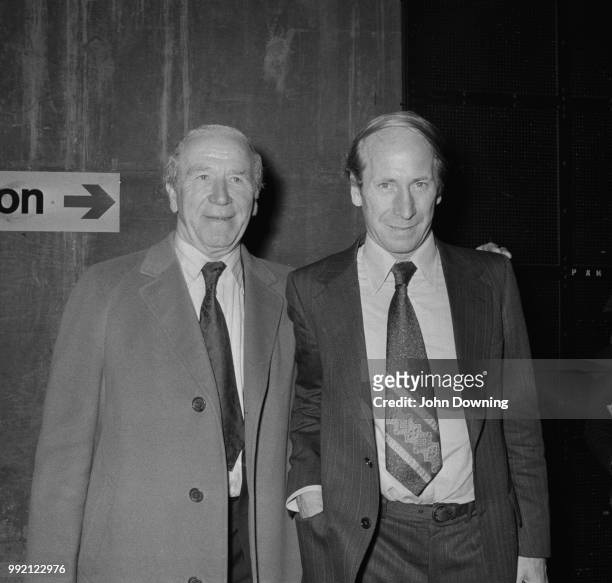 Scottish football player and manager Matt Busby and English soccer player Bobby Charlton, midfielder for Manchester United FC, who is about to play...