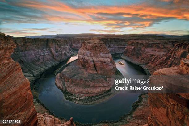 horseshoe bend of colorado river at sunset - rainer grosskopf stock pictures, royalty-free photos & images