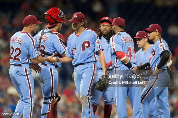 Manager Gabe Kapler of the Philadelphia Phillies takes Aaron Nola out of the game as Jorge Alfaro, Maikel Franco, Carlos Santana, Scott Kingery, and...