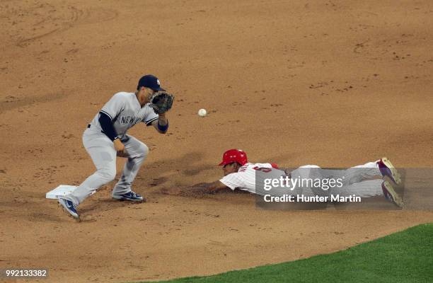 Nick Williams of the Philadelphia Phillies slides into second base as Gleyber Torres of the New York Yankees receives the throw during a game at...