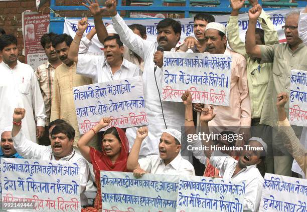 Activists from Indian Muslims National Forum shout slogans against Hurriyat Conference during a demonstrationin at Jantar Mantar on June 30, 2008 in...