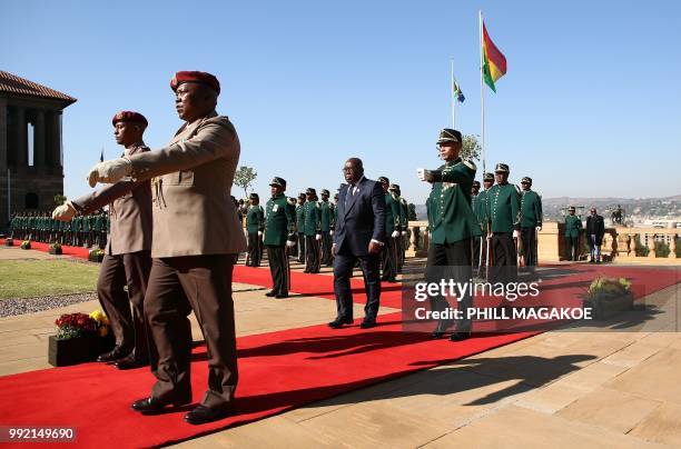 Ghana President Nana Akufo-Addo inspects a military honour guard at the Union Building in Pretoria, South Africa, on July 5 during his official state...