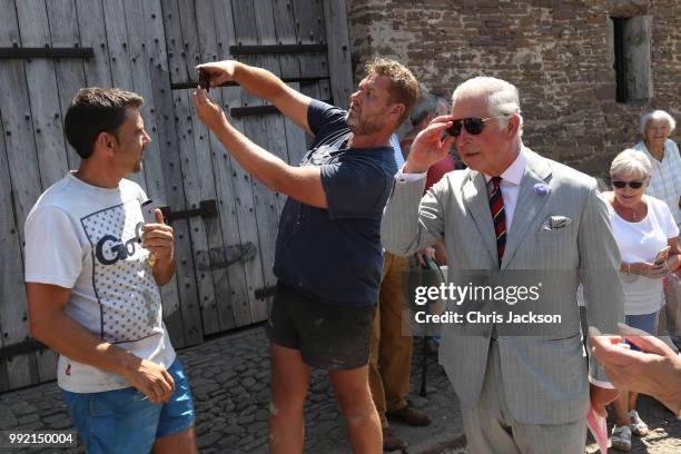 Member of the public takes a "Selfie" with Prince Charles, Prince of Wales as he visits Tretower Court on July 5, 2018 in Crickhowell, Wales.