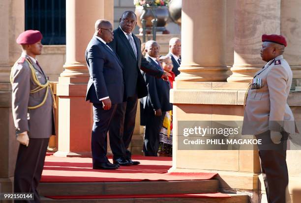 South African President Cyril Ramaphosa stands next to Ghana President Nana Akufo-Addo during a welcoming ceremony at the Union Building in Pretoria,...