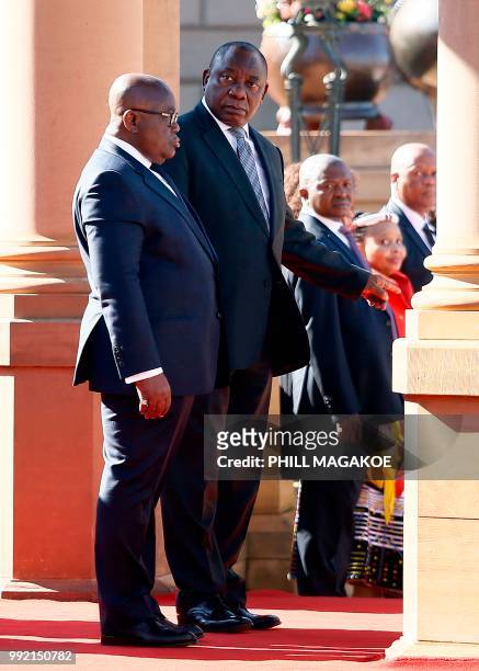 South African President Cyril Ramaphosa stands next to Ghana President Nana Akufo-Addo during a welcoming ceremony at the Union Building in Pretoria,...