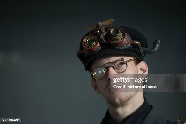 Steampunk performer standing photographed during a photo shoot in Stuttgart, Germany, 23 November 2017. Several fairs are occupying the halls of...