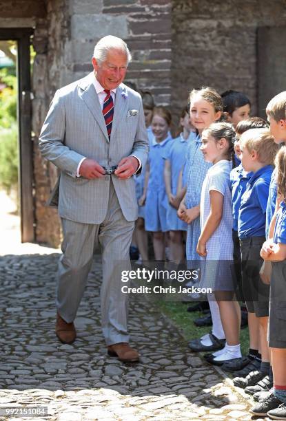 Prince Charles, Prince of Wales greets school children as he visits Tretower Court on July 5, 2018 in Crickhowell, Wales.