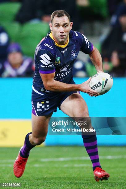 Cameron Smith of the Storm runs with the ball during the round 17 NRL match between the Melbourne Storm and the St George Illawarra Dragons at AAMI...