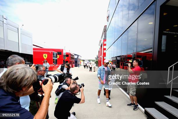 Lewis Hamilton of Great Britain and Mercedes GP arrives at the circuit during previews ahead of the Formula One Grand Prix of Great Britain at...