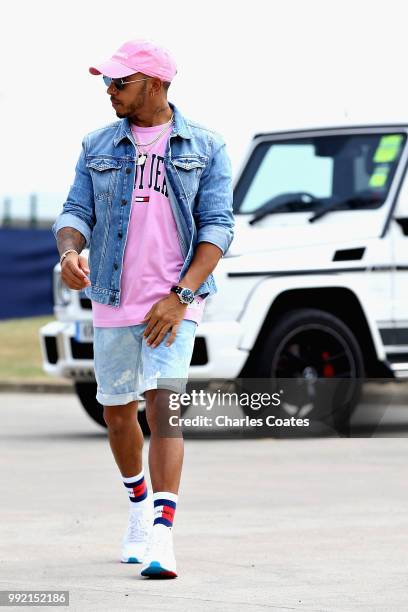 Lewis Hamilton of Great Britain and Mercedes GP arrives at the circuit during previews ahead of the Formula One Grand Prix of Great Britain at...