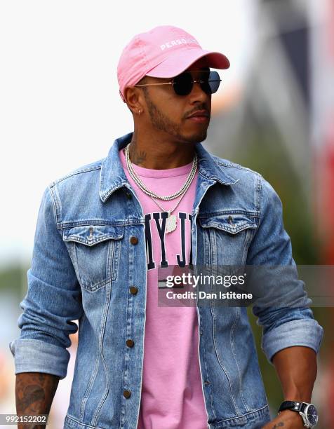 Lewis Hamilton of Great Britain and Mercedes GP arrives at the circuit during previews ahead of the Formula One Grand Prix of Great Britain at...