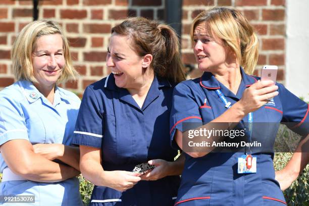 Staff look-on as Kathy Cowell, Chairman MFT and Mayor of Manchester Andy Burnham unveil a commemorative blue plaque marking Trafford Hospital as the...