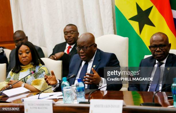 Ghana President Nana Akufo-Addo sits next to Ghana's High Commissioner George Ayisi Boateng as he delivers his opening remarks during his meeting...