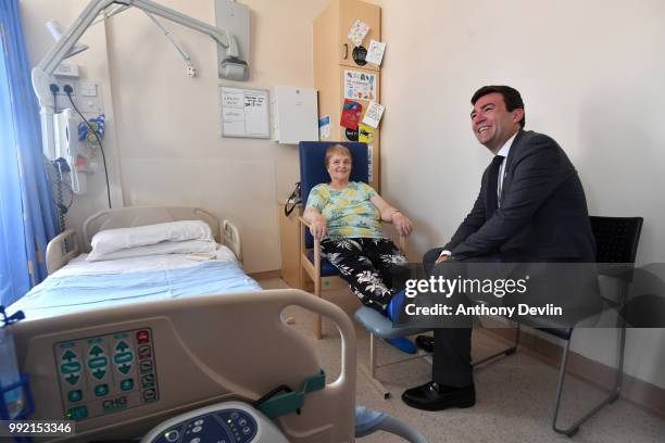 Mayor of Manchester Andy Burnham meets patient Kathleen Henry on Ward 6, where Health Minister Aneurin Bevan met the first NHS patient in 1948,...