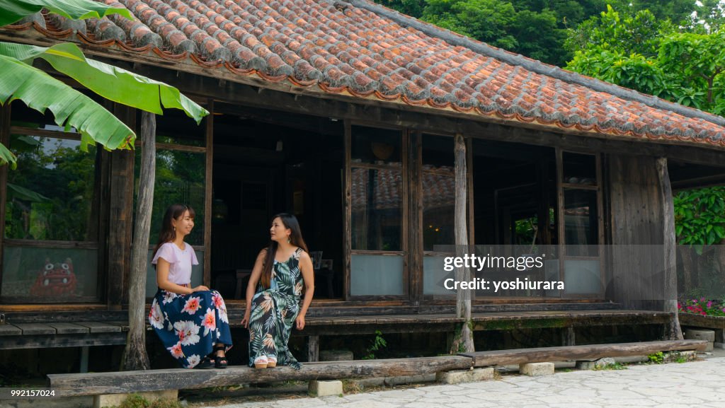 A woman relaxing in an old private house in Okinawa