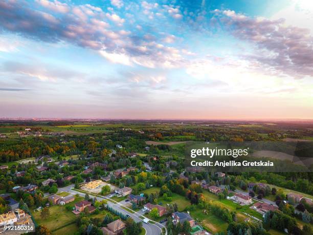 sunset at small town on aerial view in summer, ontario, canada - country town stock-fotos und bilder