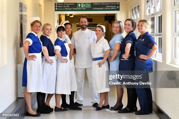 Nurses in uniforms to represent each decade of the NHS pose inside Trafford Hospital to celebrate the 70th birthday of the NHS at Trafford Hospital,...