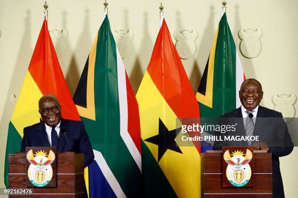 Ghana President Nana Akufo-Addo and South African President Cyril Ramaphosa smile as they address a joint press conference following their meeting at...