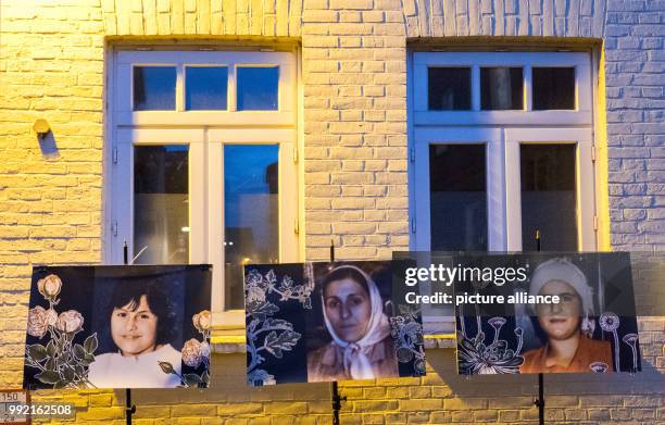 Photographs of Yeliz Arslan , Bahide Arslan and Ayse Yilmaz are displayed in front of the "Bahide Arslan House" in Moelln, Germany, 16 November 2017....