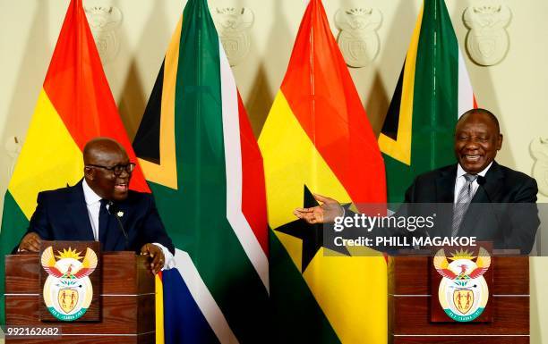 Ghana President Nana Akufo-Addo and South African President Cyril Ramaphosa smile as they address a joint press conference following their meeting at...