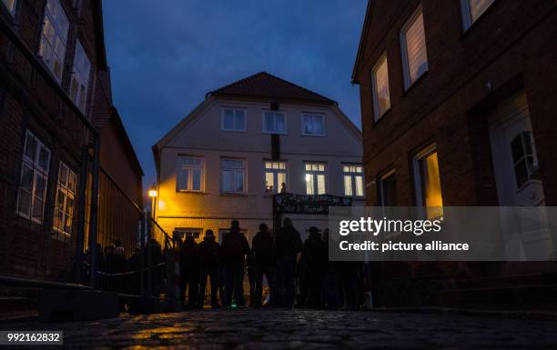 Numerous people have gathered in front of the "Bahide Arslan House" in Moelln, Germany, 23 November 2017. A right-wing terrorist arson attack ripped...