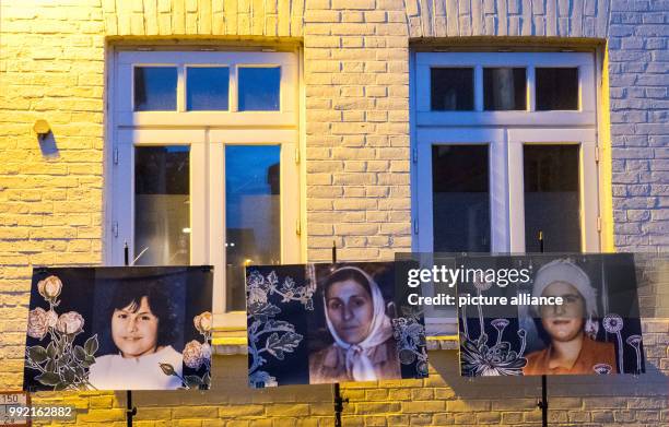 Photographs of Yeliz Arslan , Bahide Arslan and Ayse Yilmaz are displayed in front of the "Bahide Arslan House" in Moelln, Germany, 16 November 2017....